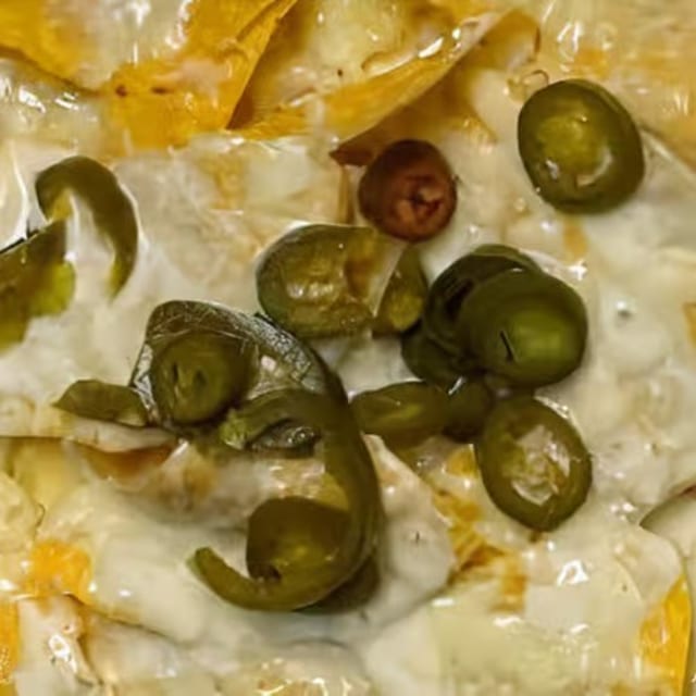 42. Cheese Nachos with Jalapeños.