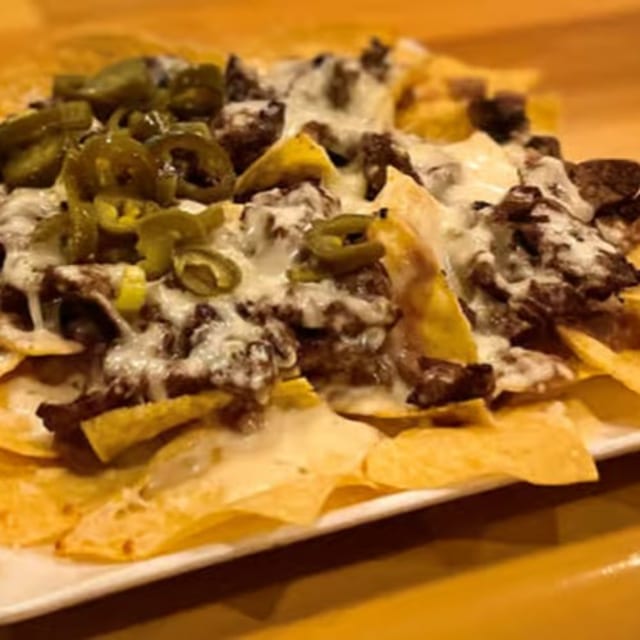 40. Nachos Steak, Beans and Cheese.